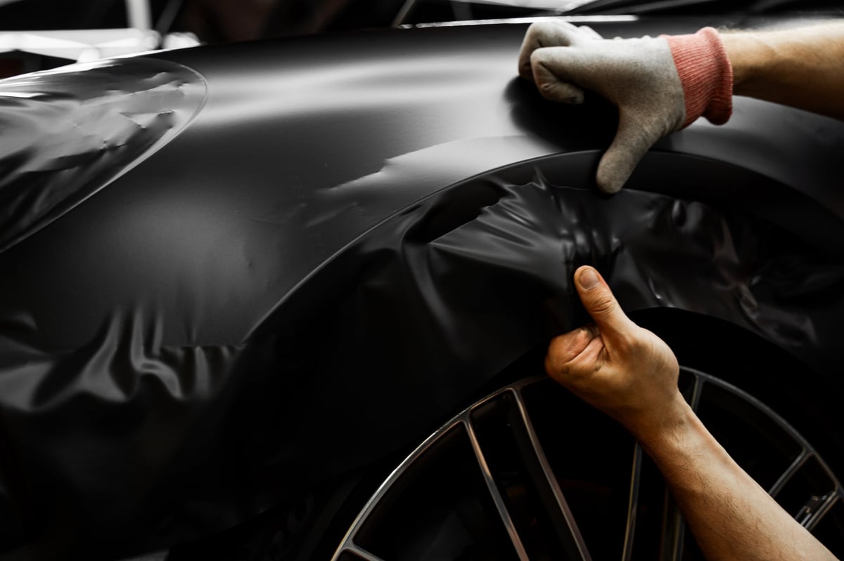 Matte black vinyl wrapping applied to luxury vehicle by Imagine Graffix in Pretoria